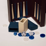 Close-up detail of the burgundy classic leather backgammon set, showing handcrafted leather triangles and resin playing stones.