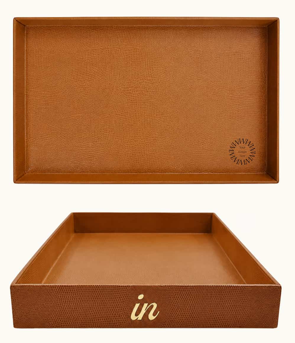Large cognac desk tray with gold "in" lettering shown from the front, showing logo placement