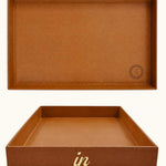 Large cognac desk tray with gold "in" lettering shown from the front, showing logo placement