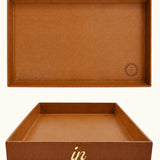 Large cognac desk tray with gold "in" lettering shown from the front, showing logo placement