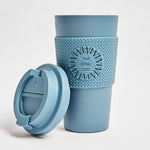 Compostable Tumbler 16oz in blue, lid off, showing logo placement