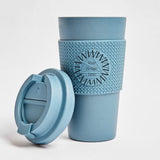 Compostable Tumbler 16oz in blue, lid off, showing logo placement