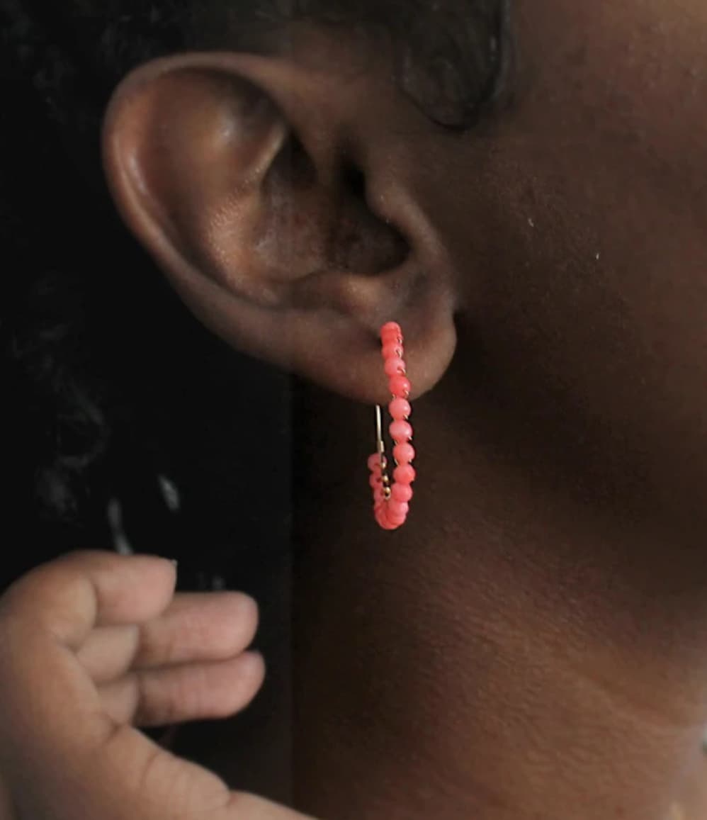 Handcrafted coral beaded hoop earrings, a unique corporate gift for women