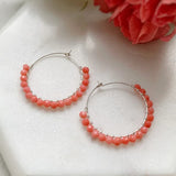 Handcrafted coral beaded hoop earrings, a unique corporate gift for women, ideal for International Women's Day