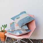 Handwoven cotton cushion cover styled on sofa, event styling and brand activation for corporate events