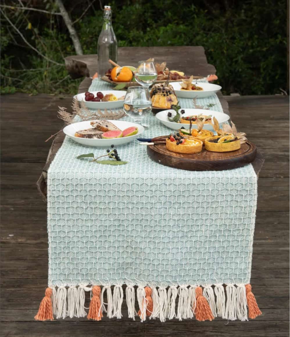 Handwoven organic cotton table runner styled on dining table, event styling for corporate dinners and brand activations
