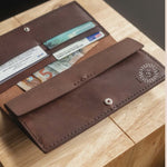 Hand-stitched long leather wallet, a personalised corporate hospitality gift for clients.