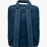 Daily 15" Backpack shown from the back, featuring padded shoulder straps, a top carry handle, and multiple zippered pockets, photographed against a plain white background.