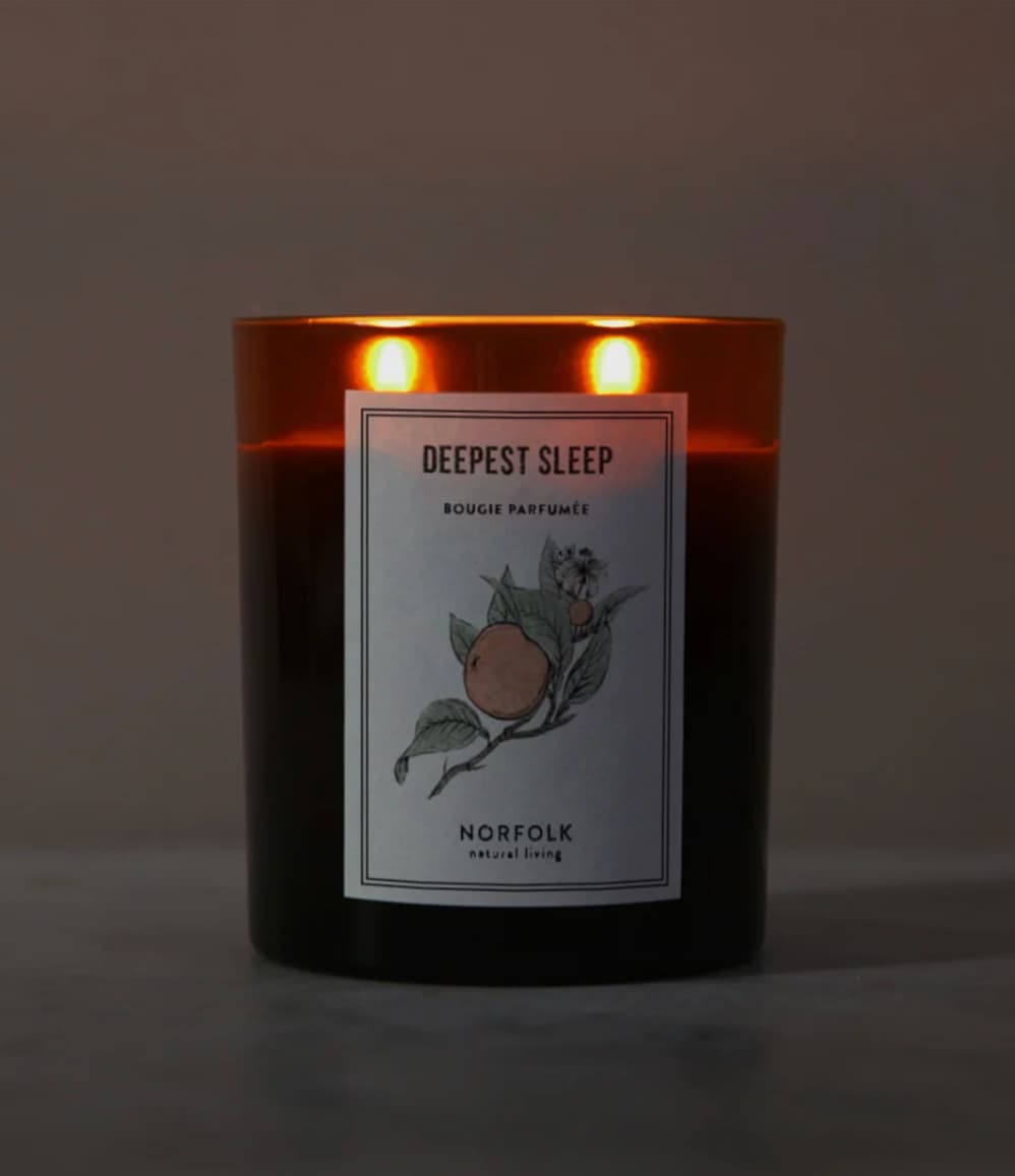 Deepest Sleep aromatherapy candle by Norfolk Natural Living, lit with two wicks
