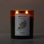 Deepest Sleep aromatherapy candle by Norfolk Natural Living, lit with two wicks