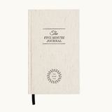 The Five Minute Wellness Journal in an oat linen cover, a thoughtful corporate gift idea for women employees from women-owned brands.