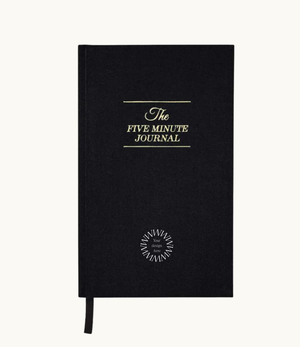 The Five Minute Journal, front cover in black, showing logo placement