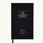The Five Minute Journal, front cover in black, showing logo placement