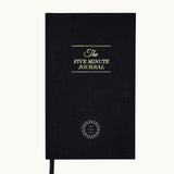 The Five Minute Journal, front cover in black, showing logo placement