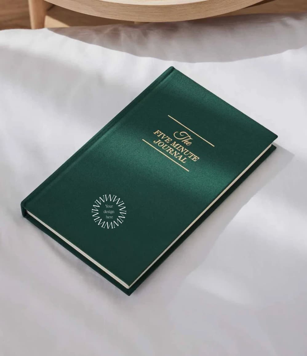The Five Minute Journal, front cover in green, showing logo placement