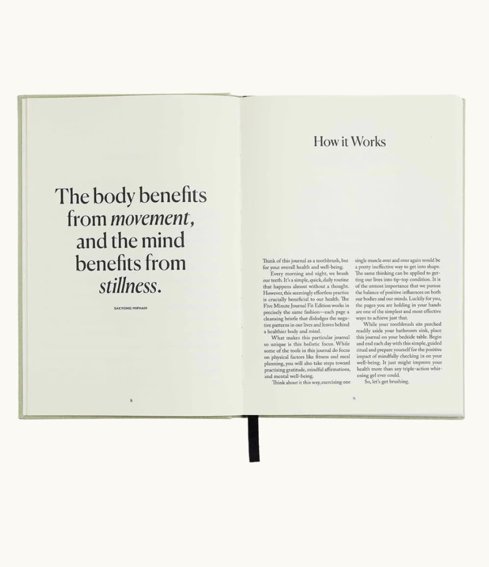 Five Minute Journal Health & Fitness Edition, open to the page "The body benefits from movement and the mind from stillness"