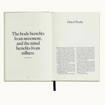 Five Minute Journal Health & Fitness Edition, open to the page "The body benefits from movement and the mind from stillness"