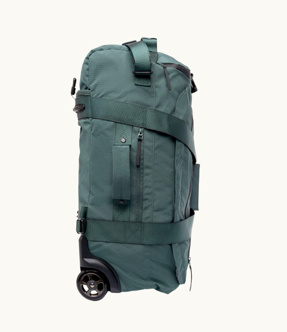 Foldable travel bag with wheels in sage green. Recycled rPET eco friendly corporate thank you gift