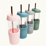 Side view glass smoothie cup with sleeve and straw, premium eco swag for conference giveaways
