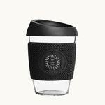 Glass Coffee Cup 12oz in black, with a silicone thermal sleeve, showing logo placement