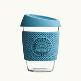 Glass Coffee Cup 12oz in blue, with a silicone thermal sleeve, showing logo placement