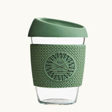 Glass Coffee Cup 12oz in green, with a silicone thermal sleeve, showing logo placement