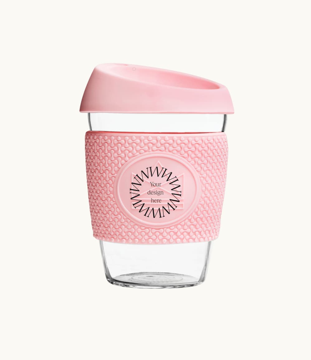 Glass Coffee Cup 12oz in pink, with a silicone thermal sleeve, showing logo placement
