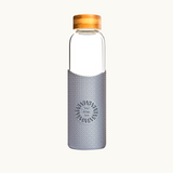 Sustainable 550ml glass water bottle with grey silicone sleeve and bamboo lid eco branded swag for corporate gifts