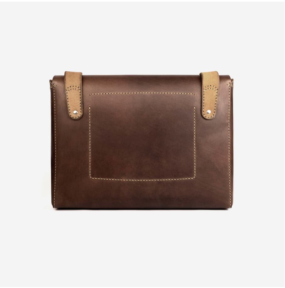 Hand-stitched full-grain leather laptop bag in tan, a sustainable corporate gift from women-owned brands
