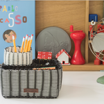 A handwoven upcycled desk organizer in black and white. Unique sustainable corporate gifts 