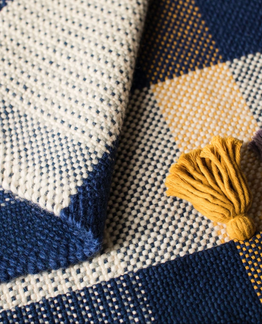 Handwoven designer wool rug detail artisan corporate gift UK