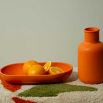 Large oval ceramic serving platter in orange, event gift