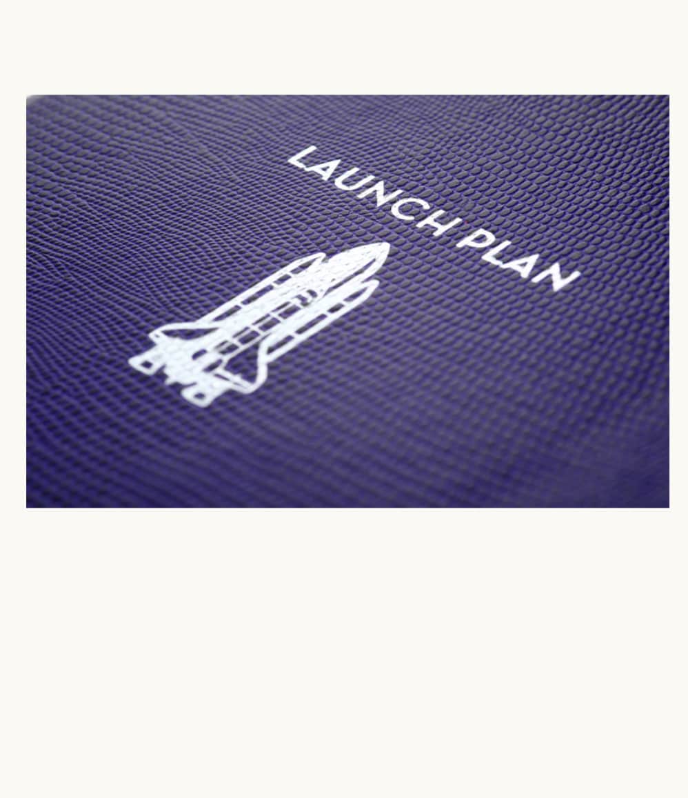 Launch Plan Hardcover Notebook, silver embossing detail on the cover.