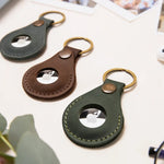 Leather AirTag holder keyrings in green and brown
