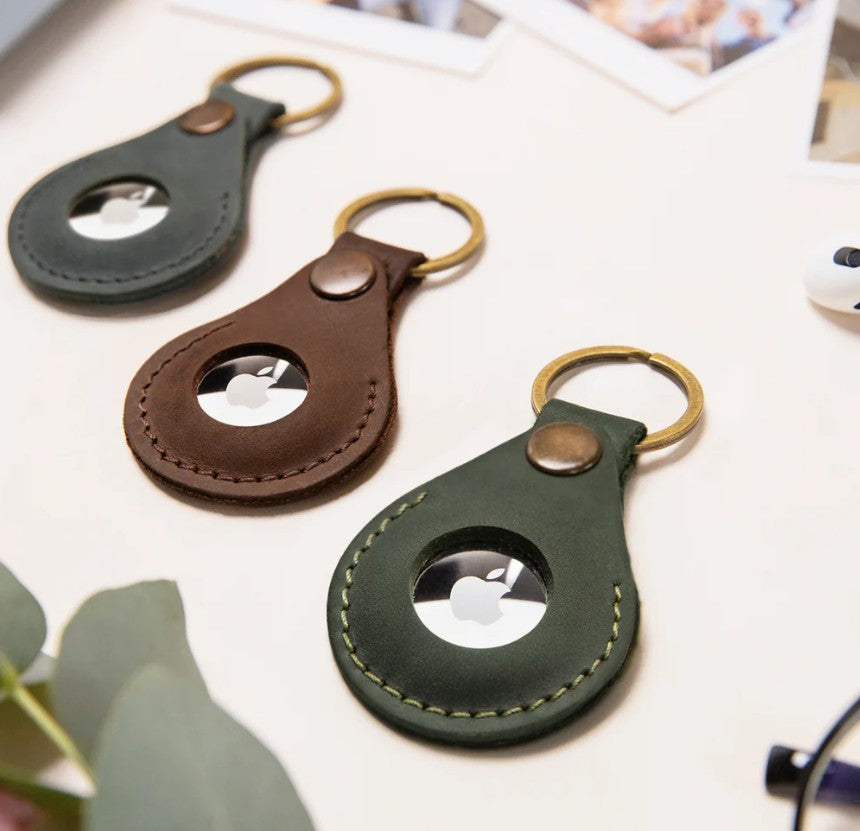 Leather AirTag holder keyrings in green and brown