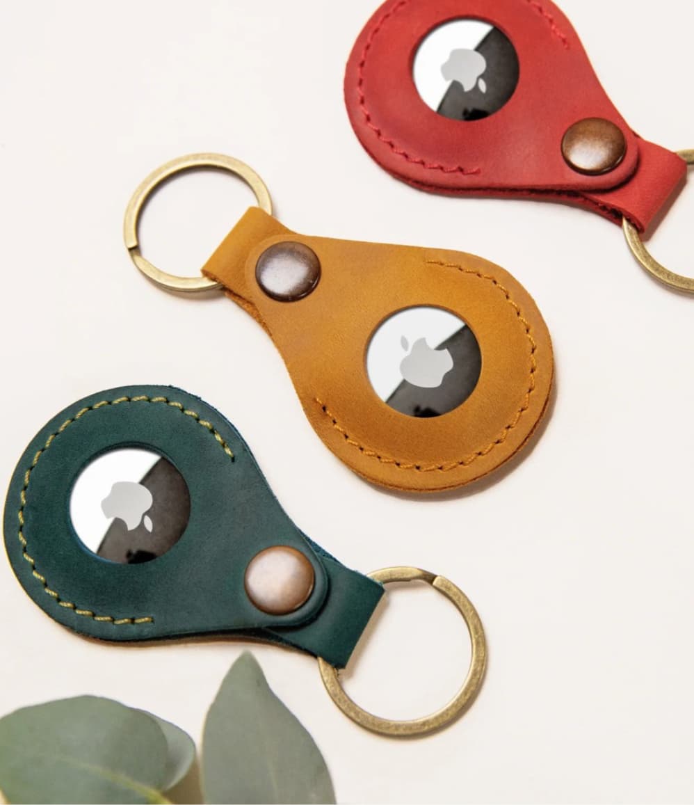 Leather AirTag holder available in mustard, forest green and red