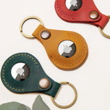 Leather AirTag holder available in mustard, forest green and red