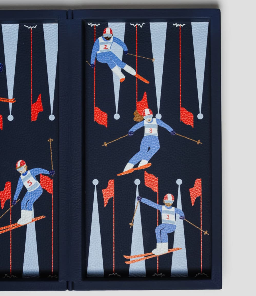 Close-up of luxury leather backgammon set with colourful alpine skier illustration and red slalom flags