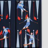 Close-up of luxury leather backgammon set with colourful alpine skier illustration and red slalom flags