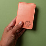 Leather Bifold RFID Wallet in coral, showing logo placement