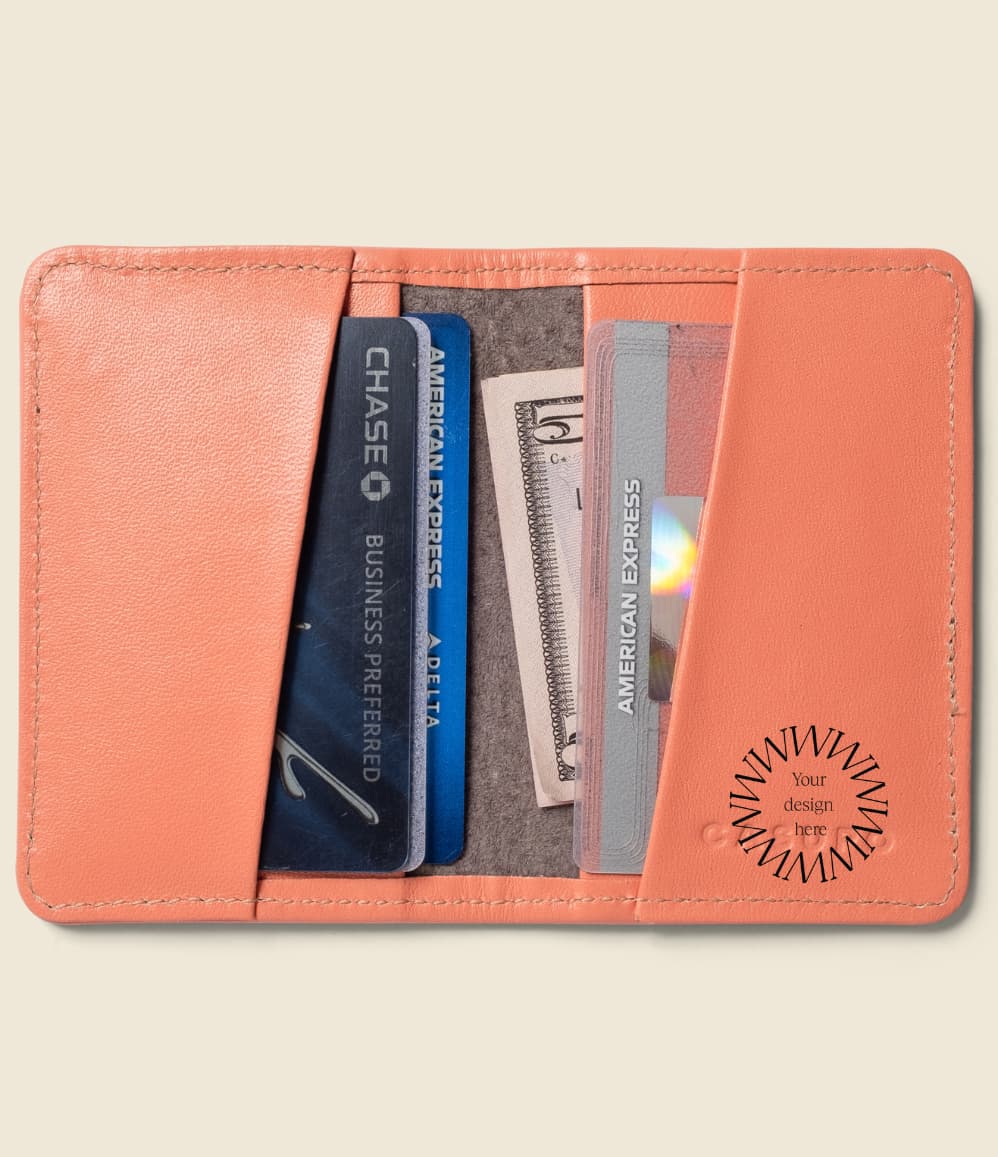 Leather Bifold RFID Wallet in coral, open, showing logo placement.