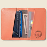 Leather Bifold RFID Wallet in coral, open, showing logo placement.