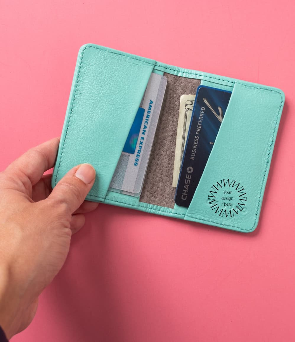 Leather Bifold RFID Wallet in light blue, open, showing logo placement
