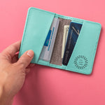 Leather Bifold RFID Wallet in light blue, open, showing logo placement
