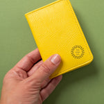 Leather Bifold RFID Wallet in yellow, showing logo placement