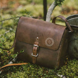Hand-stitched leather crossbody bag in brown, a sustainable corporate gift from women-owned brands