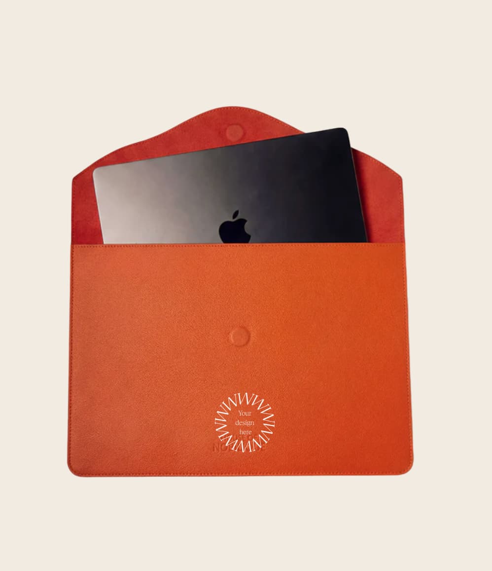 Interior detail of orange leather laptop case, padded sleeve for executive corporate gift
