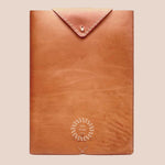 Premium leather laptop sleeve, hand-stitched by women artisans in India, executive corporate gift.