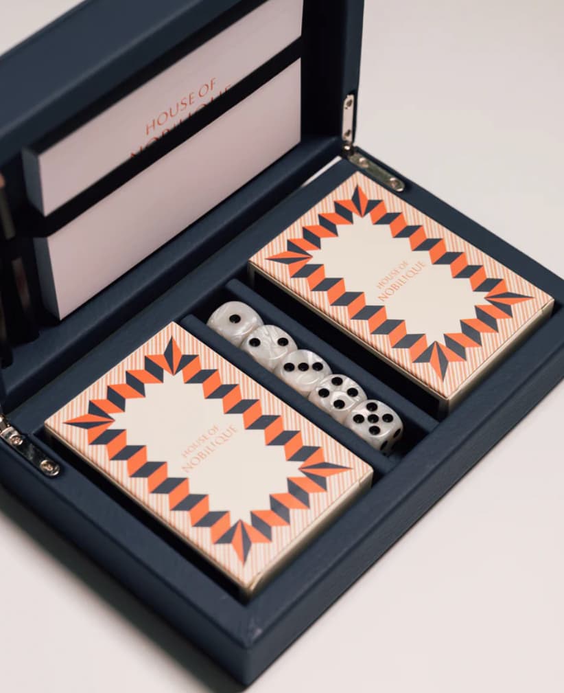 Blue leather playing cards set with magnetic closure, a personalised corporate gift from women-owned brands.