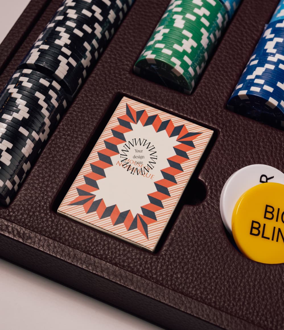 Close-up detail of the handcrafted leather poker set, showing stitching and magnetic closure on a sustainable corporate gift.